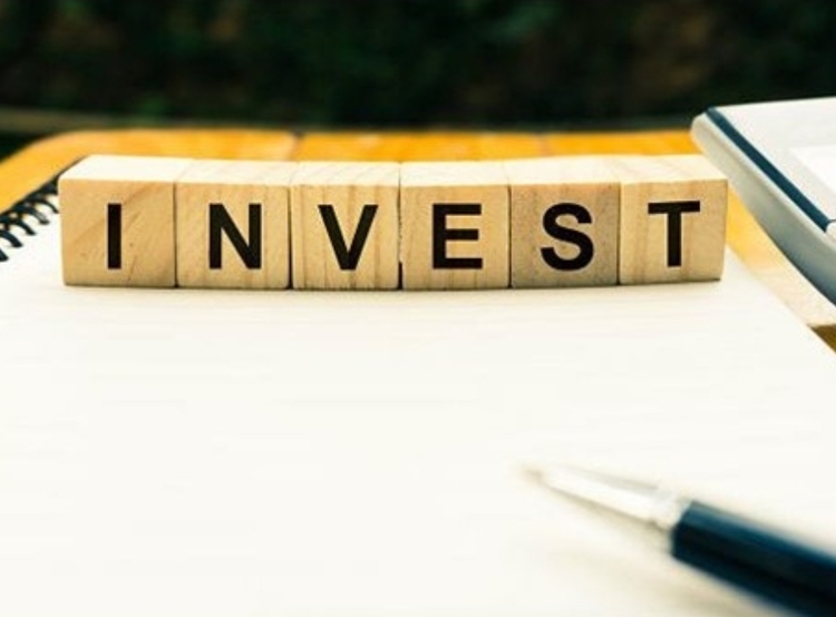 Cubes spelling invest on table